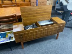An HMV radiogram in teak cabinet