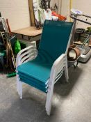 A set of four metal framed stacking garden armchairs