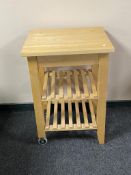 A pine butcher's block trolley