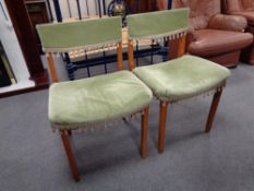 A set of four mid century teak dining chairs