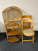 Two folding beech kitchen chairs together with a wicker arch topped shelving unit and teak three