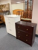 A white high gloss double door cabinet fitted with two drawers together with a further three drawer
