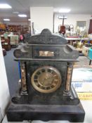 A Victorian marble and black slate mantel clock