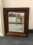 A mahogany-framed bevel-edged mirror, 34 cm x 29 cm.