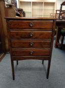 An Edwardian four drawer music cabinet