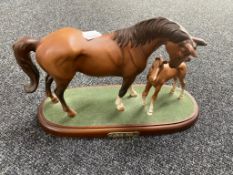 A Royal Doulton figure, First Born,