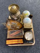 A tray of brass oil lamp, globe ornaments, ammunition shell,