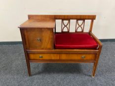 A twentieth century mahogany telephone table
