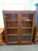 An Edwardian oak bookcase , width 99 cm.