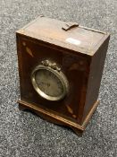 An antique inlaid mahogany mantel clock by Harvey of Newark