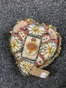 A heart shaped sweetheart pin cushion,