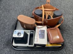 A tray of two sets of leather cased binoculars; Swift and Denhill,