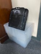 Seven clear plastic storage containers with lids