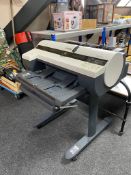 A Canon Ipf 500 image prograf printer on stand