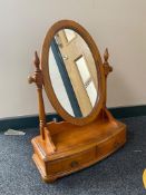 A contemporary toilet mirror fitted two drawers