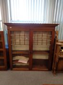 A Victorian mahogany double door glazed bookcase, width 146 cm.