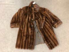 A lady's brown fur coat, 3/4 length, with 