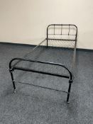 An antique painted 3' cast iron bed frame