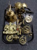 A tray of brass ware, ship's bell, hand bell, ornamental swords,