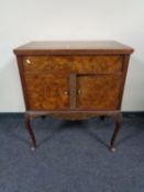 A walnut gramophone cabinet on cabriole legs