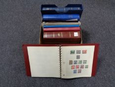 A box of stamp albums, coronation stamps,