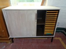 An office stationary cupboard on metal legs