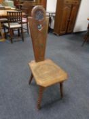 A carved spinning chair