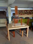 A contemporary pine dining table with leaf together with a set of three high backed mango wood