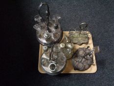 A tray of five antique plated cruet stands and assorted cruet bottles