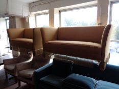 A pair of twentieth century two seater settees in golden fabric