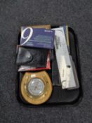 A tray of scientific calculators, boxwood chess set, rolling rulers,