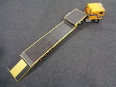 An International remote controlled freight truck with flat bed trailer,