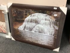 A framed glitter picture depicting a waterfall