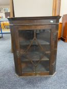 A Georgian oak astral glazed corner cabinet