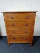 A twentieth century oak four drawer chest