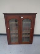 A Victorian glazed double door bookcase