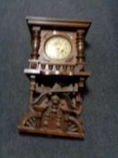 An early twentieth century continental wall clock with brass and enamelled dial (af)