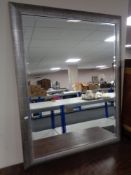 A contemporary bevelled overmantel mirror