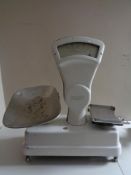 A set of twentieth century enamelled grocer's scales