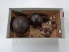 A box of antique cannon balls and shots