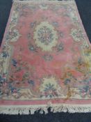 A pink embossed Chinese carpet,