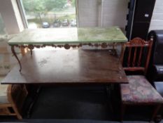 An onyx effect coffee table on metal base and an oak refectory table