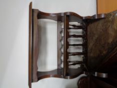 A reproduction mahogany magazine rack