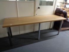 An oak effect table on metal legs