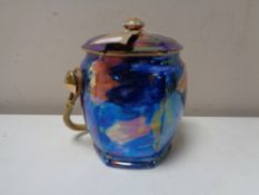 A Maling Storm pattern lidded biscuit barrel with wicker handle