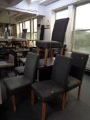 A contemporary extending dining table and six cloth covered chairs