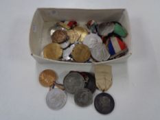 A box of early twentieth century Royal Family medals, some on ribbons etc.