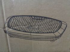 A boxed Vibra power vibration plate