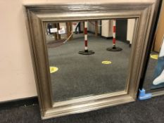 A silvered framed mirror