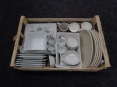 A box of contemporary dinner ware and mugs